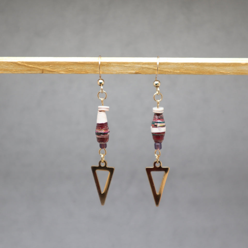 Pair of earrings with triangle-shaped pendants on a gray background, paper Uganda, stainless steel, shell