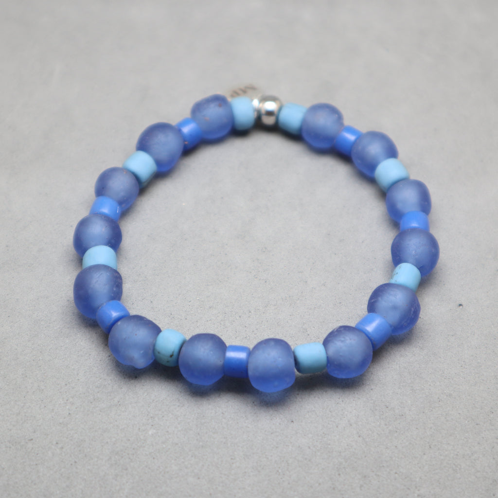 Blue beaded bracelet on a gray background,blue glass recycled