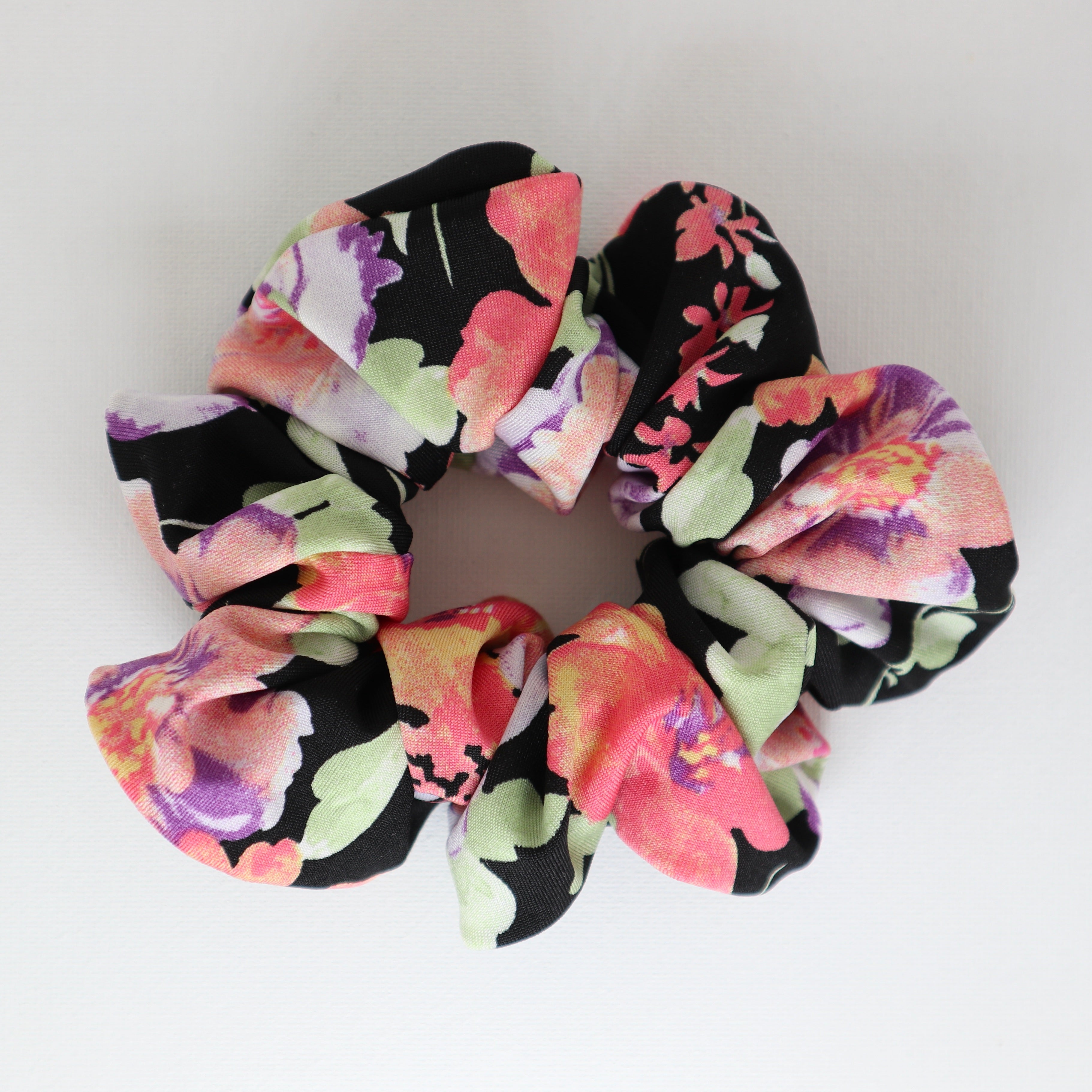 Floral coral  purple pink scrunchie on a white background