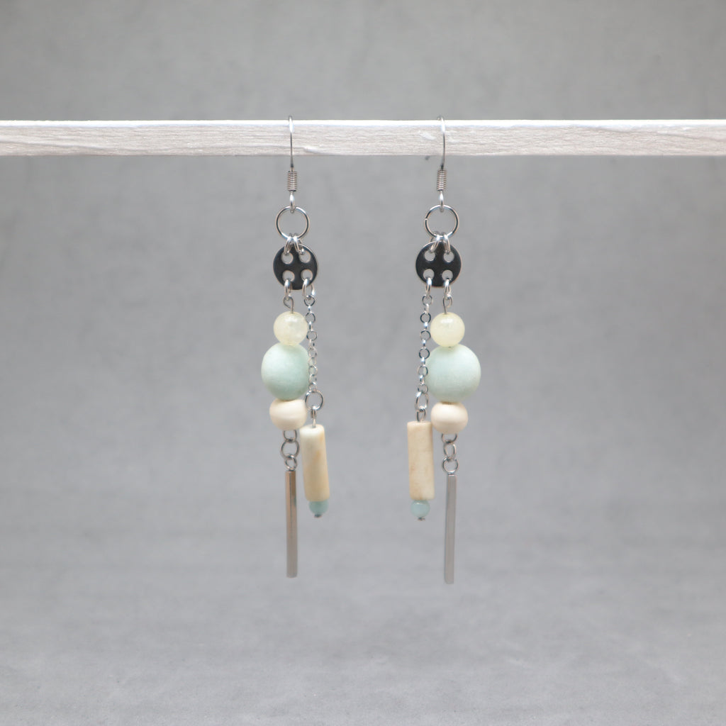 Pair of earrings with beads and bars on a gray background, amazonite, citrin