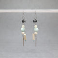 Pair of earrings with beads and bars on a gray background, amazonite, citrin