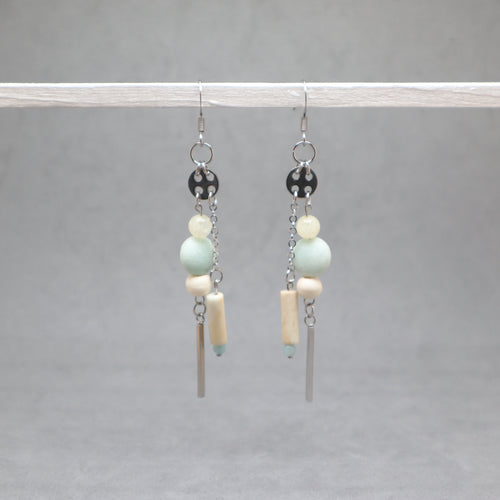 Pair of earrings with beads and bars on a gray background, amazonite, citrin