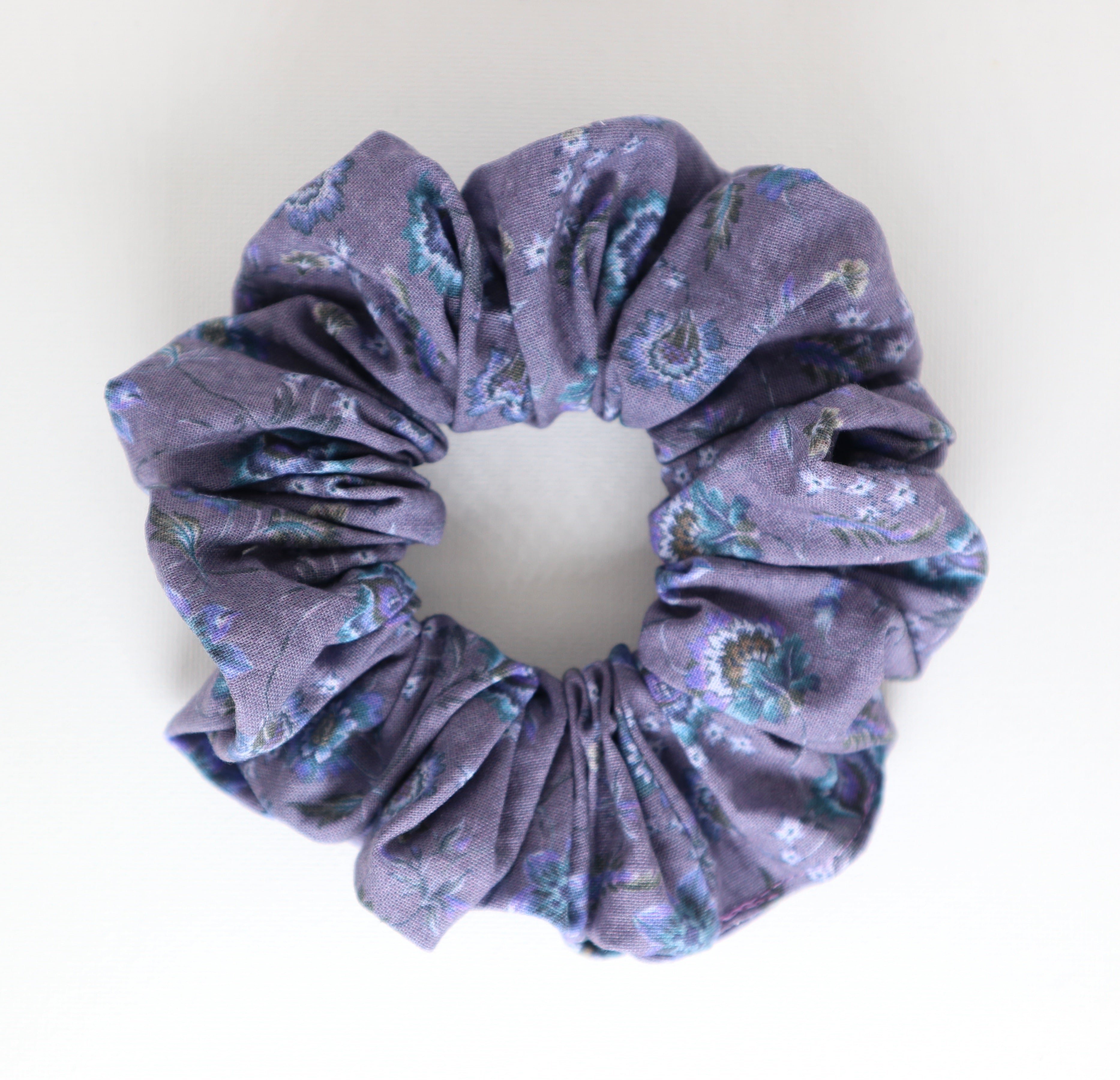 Floral purple patterned scrunchie on a white background